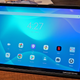 A photo of the Lenovo Yoga Tab 13 on a wooden table.